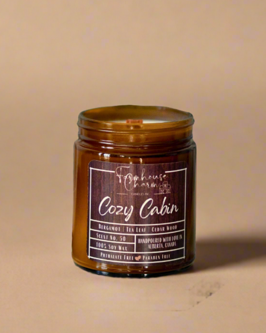 Cozy Cabin Soy Candle is more than just a candle, it's an experience that will take you on a journey to a place of comfort and relaxation. The blend of bergamot, tea leaf, and cedarwood creates a unique fragrance that is perfect for fall and adds a touch of farmhouse charm to any living space. www.farmhousecharmcandles.com