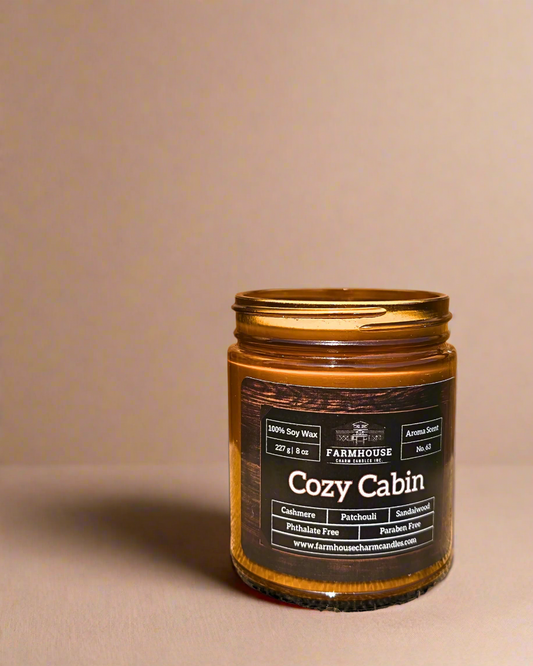 Experience the warmth and comfort of fall with our newly formulated Cozy Cabin Soy Candle- Aroma Scent No. 63. Infused with rich notes of cashmere, patchouli, and sandalwood, this candle delivers a deep, rustic aroma that transforms any space into a cozy retreat. It’s more than just a candle – it’s an invitation to unwind and relax in the comforting embrace of farmhouse charm.