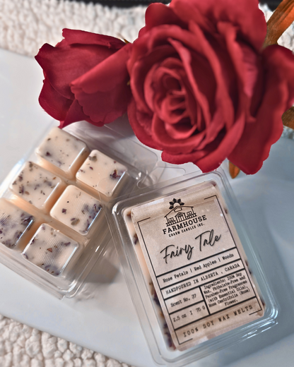 Farmhouse Charm Candles. Bring timeless beauty and a captivating aroma to your space with our Fairy Tale Wax Melts. Inspired by love, nostalgia, and the serene charm of nature, these wax melts feature a harmonious blend of rose petals, crisp red apples, and earthy forest woods.