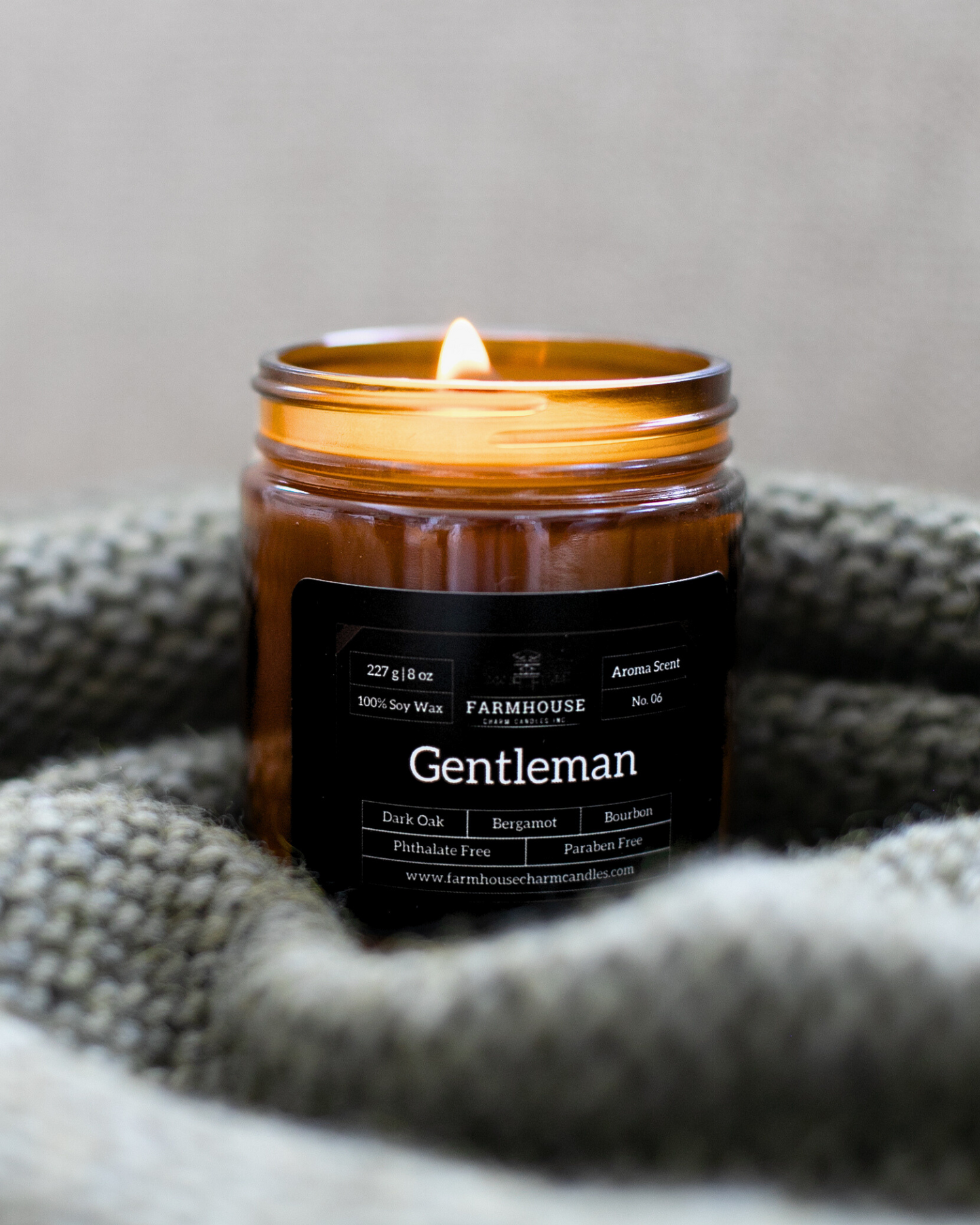 Ignite your senses with the Gentleman Soy Candle - Aroma Scent No. 6, a smooth and irresistible fragrance crafted to embody the essence of a true gentleman.  This soy candle features a powerful blend of dark oak, bergamot, and a dash of bourbon, creating an unforgettable aroma that will fill your home with sophistication and charm.  Rich Dark Oak: Brings the wilderness right into your living room. Lively Bergamot: Adds a burst of citrus freshness. Subtle Bourbon  www.farmhousecharmcandles.com