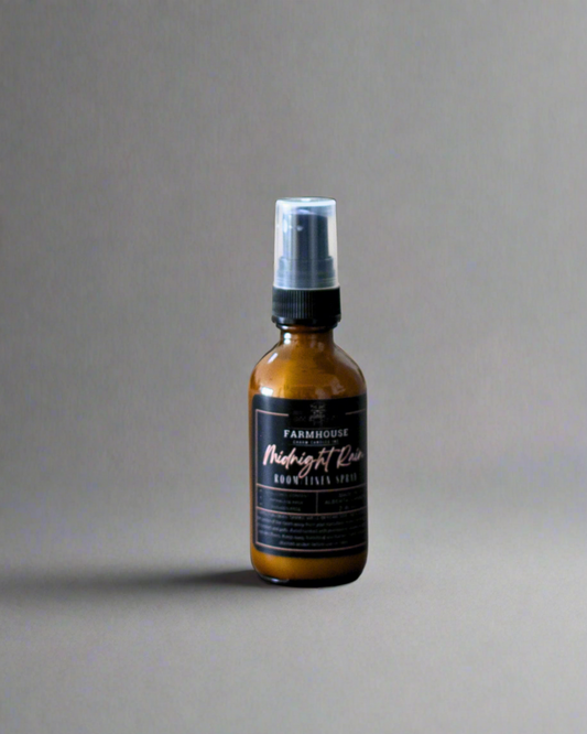 Midnight Rain Room &amp; Linen Spray, is a nostalgic blend that captures the essence of a midnight downpour. Imagine the refreshing aroma of dewy grass mingling with the delicate scent of petals kissed by rain. With a subtle hint of petrichor—the earthy fragrance that rises after a downpour—this room spray brings back memories of carefree nights and gentle pitter-patters on the windowpane. www.farmhousecharmcandles.com