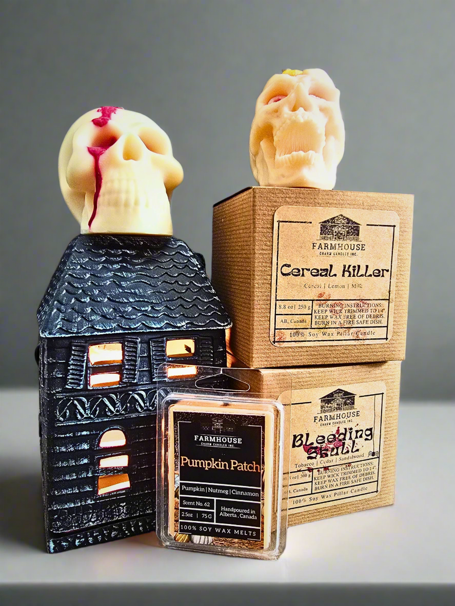 Haunted Essentials: Skulls and Pumpkins Bundle featuring a haunted house fragrance warmer, two skull-shaped soy wax candles, and pumpkin patch soy wax melts. Perfect for Halloween decor with spooky, seasonal scents. www.farmhousecharmcandles.com