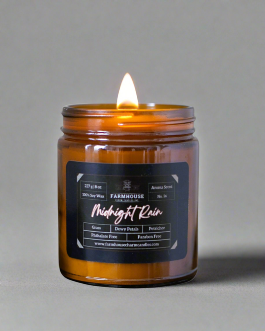 ntroducing Aroma Scent No. 36: Midnight Rain Soy Candle, a nostalgic blend that captures the essence of a midnight downpour. Imagine the refreshing aroma of dewy grass mingling with the delicate scent of petals kissed by rain. With a subtle hint of petrichor—the earthy fragrance that rises after a downpour—this candle brings back memories of carefree nights and gentle pitter-patters on the windowpane. www.farmhousecharmcandles.com