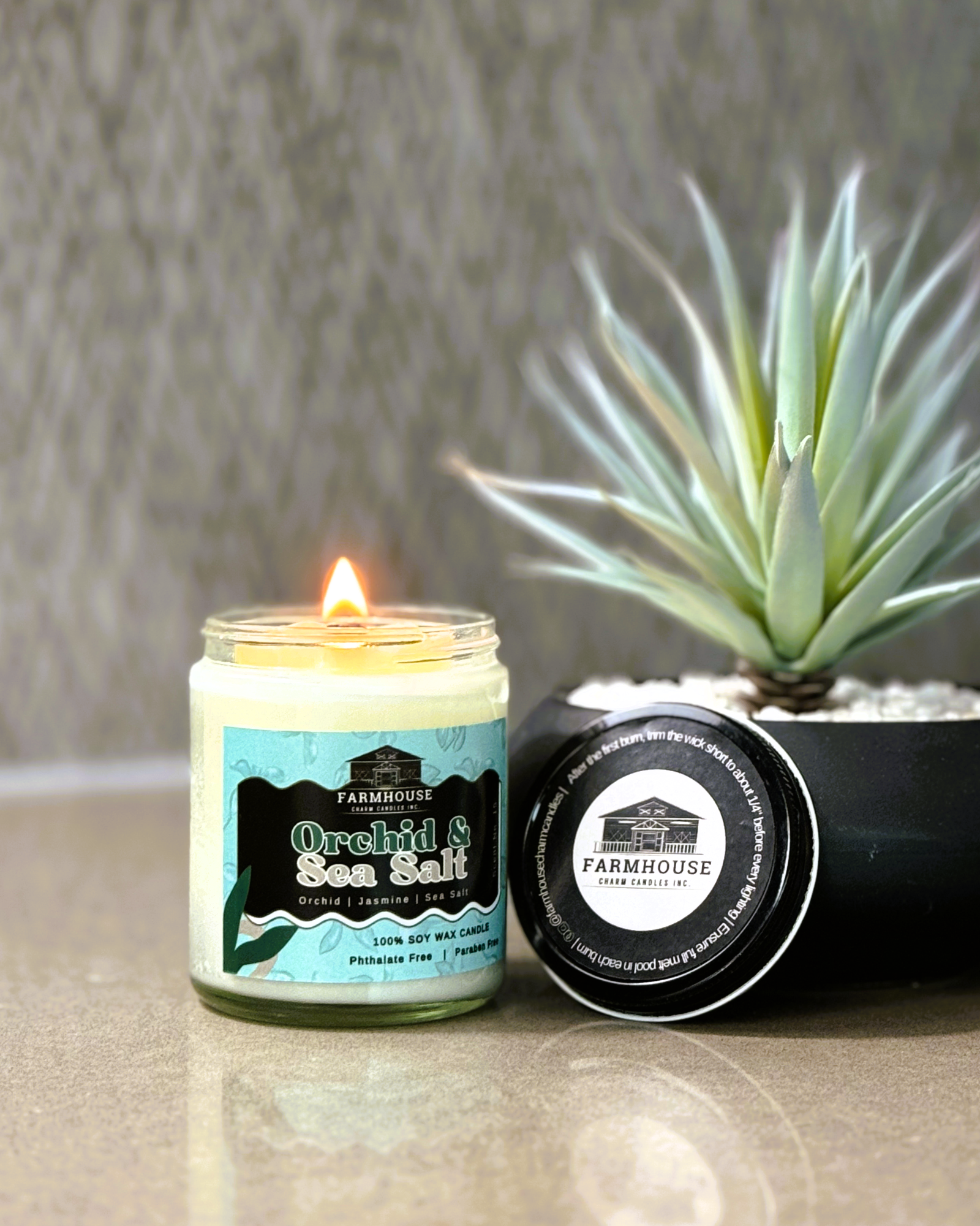 Step back into a world where every scent tells a story. Our Orchid & Sea Salt Soy Candle - Aroma Scent No. 15 will transport you to cherished moments by the sea, mingled with the sweet memories of blooming gardens. Imagine the soft floral notes of orchid, jasmine, and lily filling your home, combined with the crisp and refreshing sea salt mist. It's an elegant yet invigorating fragrance that brings the best of nature into your living space. www.farmhousecharmcandles.com