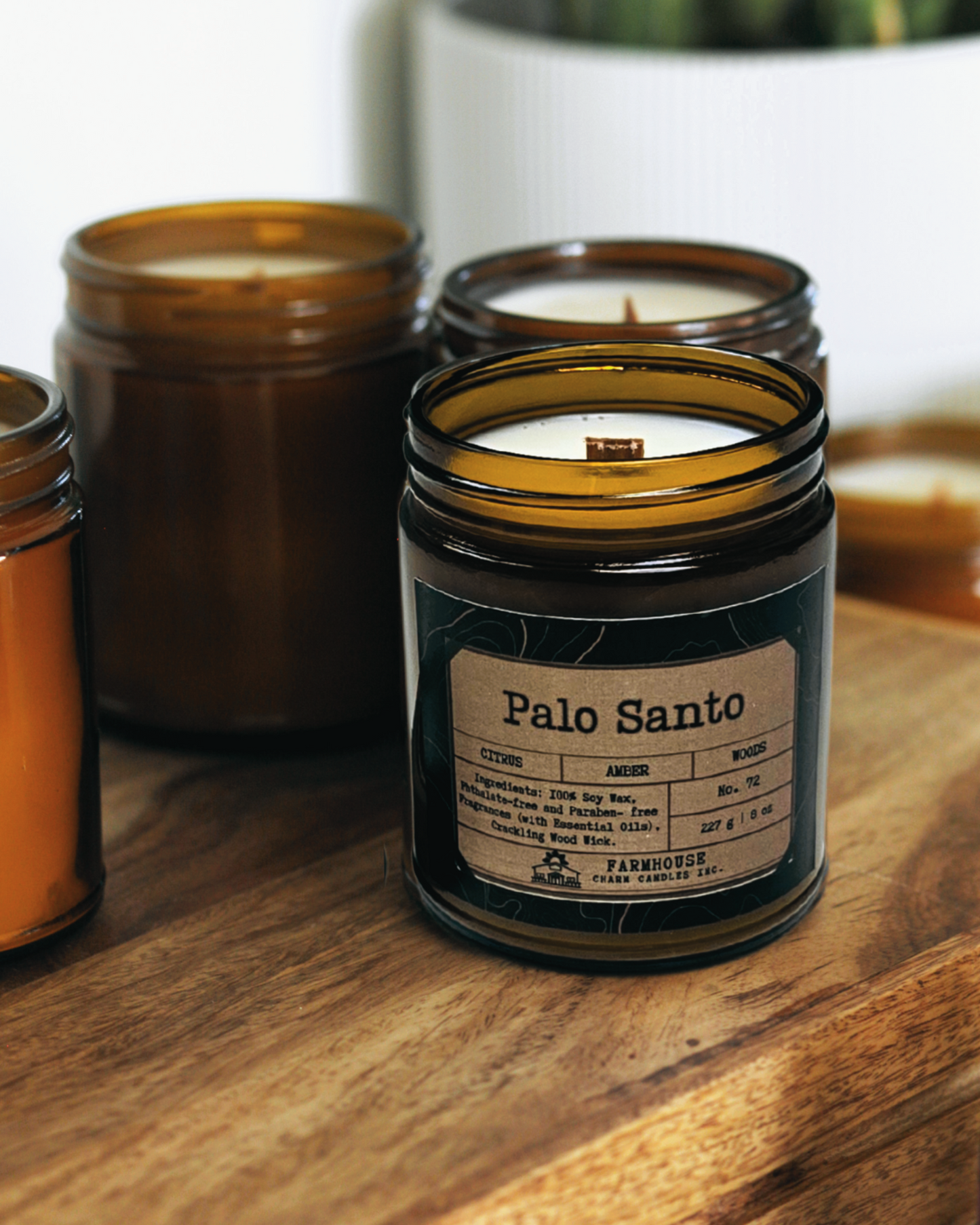 A blend of citrus, warm amber, and grounding woods, crafted to cleanse energy and invite tranquility. Perfect for resetting your space with a soothing, earthy aroma. Palo Santo Soy Candle- Farmhouse Charm Candles